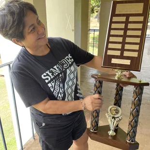 Teacher liking her new trophy.