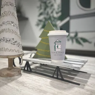 a coffee cup on a sled