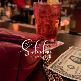 a red purse and a drink