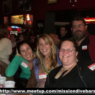 a group of people at a bar