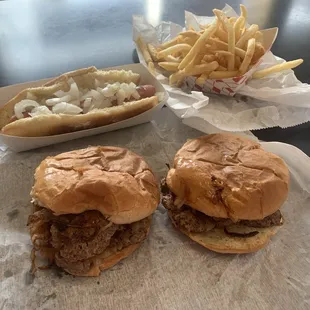 Two double sliders, dog with onions, fries.