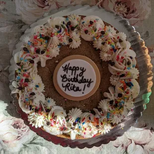 a birthday cake with frosting and sprinkles