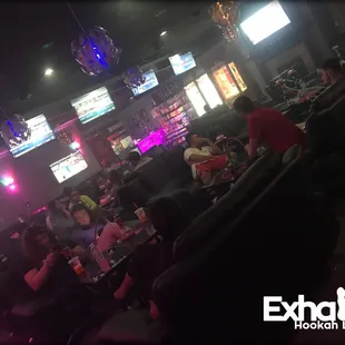 a group of people watching tvs