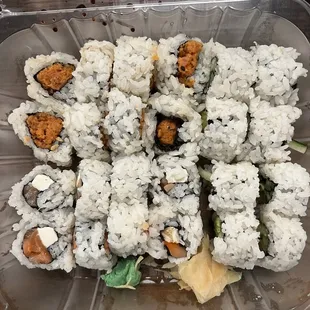 a close up of a container of sushi