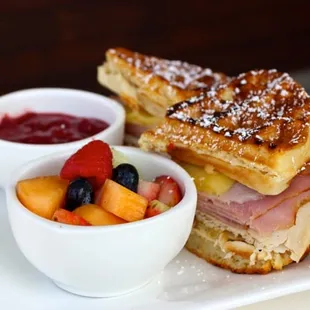 Waffle Monte Cristo -  ham, roasted turkey breast and swiss cheese pressed between a buttermilk-quinoa waffle served with seasonal fruit jam