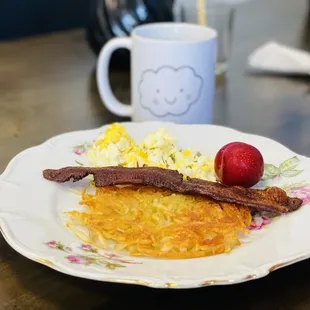 Senior meal. One bacon, scrambled eggs eggs hash potato