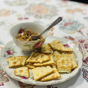 a plate of crackers and a bowl of soup