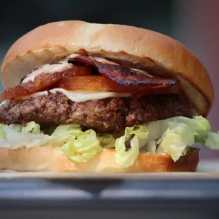 Aloha! Caramelized pineapple, turkey-bacon, american cheese, romaine lettuce, our juicy handcrafted ground-beef patty + brioche bun