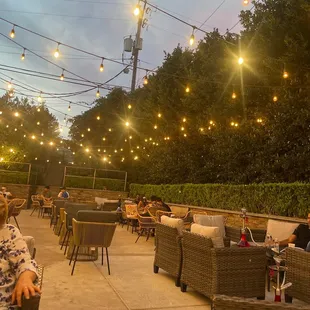 a woman sitting at a table with a laptop