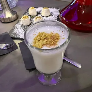 a glass of milk and some desserts