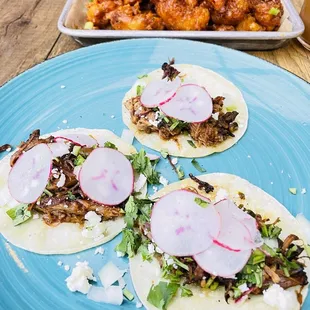 Carnitas tacos and buffalo cauliflower