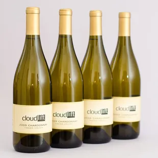 four bottles of white wine