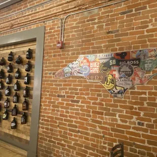 a brick wall with beer bottles on it