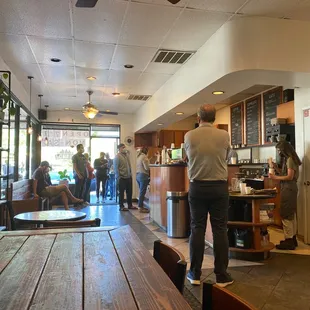 a group of people in a coffee shop