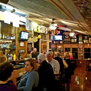 a group of people sitting at a bar