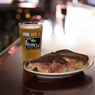 a plate of food and a glass of beer