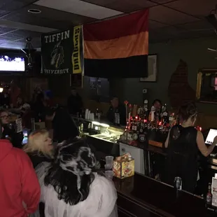 a crowd of people at a bar