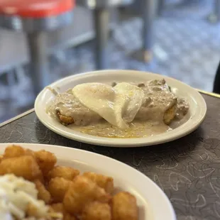 Biscuit &amp; gravy with an egg on top