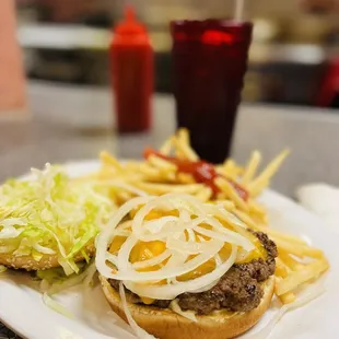 a hamburger and fries on a plate