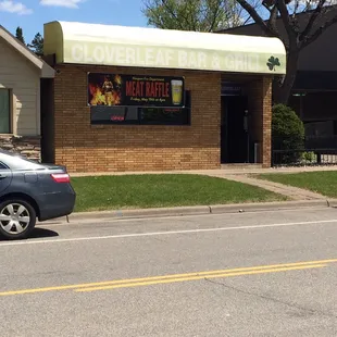 a car parked in front of the restaurant