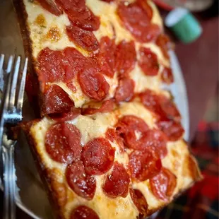 a slice of pepperoni pizza