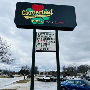 a sign for clover leaf pizza