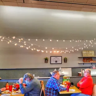 people sitting at tables eating