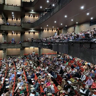 Taken from the second floor box area showing seating and audience from ground level, up.