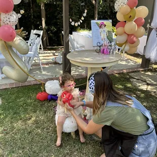 Fixing the bday girl's balloon for the pics
