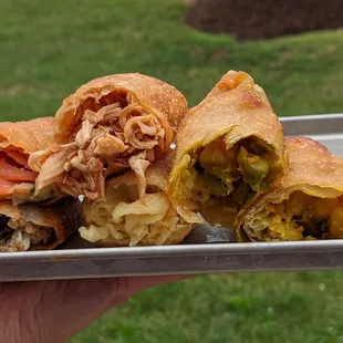 a person holding a tray of food