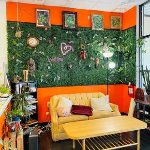 a living room with orange walls
