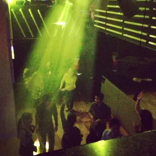 a group of people dancing at a club