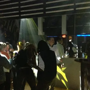 a group of people dancing in a club