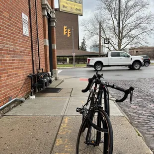 a bicycle parked on the sidewalk