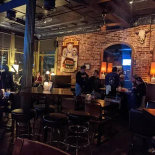 a group of people sitting at a bar