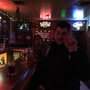 a man and a woman sitting at a bar