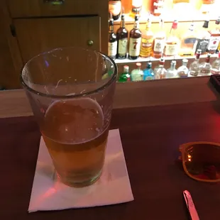 a glass of beer on a table