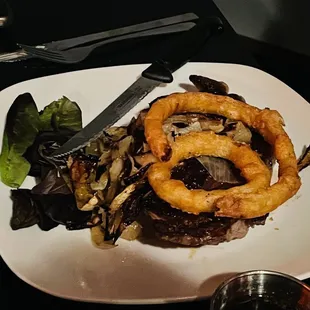 Ribeye with sautéed onions and onion ring topper
