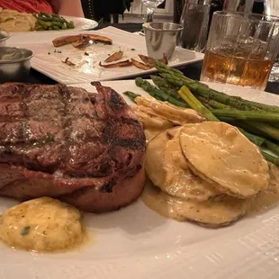Filet, au gratin potatoes and asparagus.