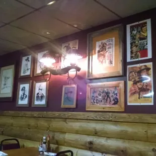 a wall of framed photos