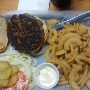 a burger, fries, and pickles