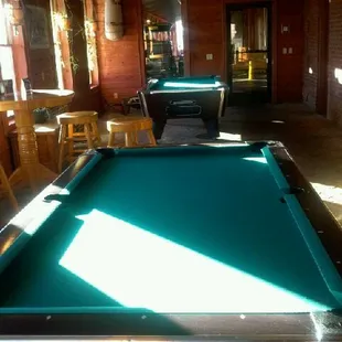 Two pool tables located in our billiard room.