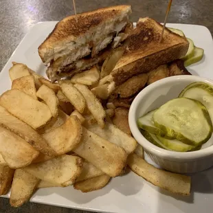 Chicken tender melt with flat fries.