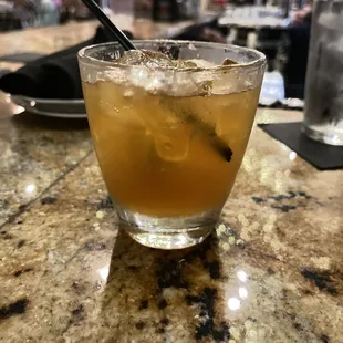 a drink in a glass on a table