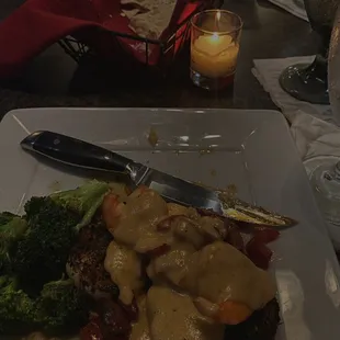a plate of food with a knife and fork
