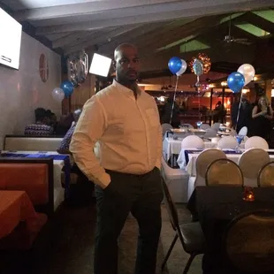 a man standing in a restaurant