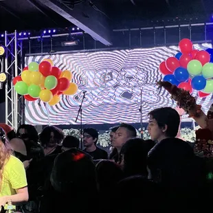 a group of people sitting at a bar