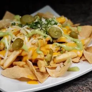 Nacho Fries. Add Chicken, Asada or Birria
