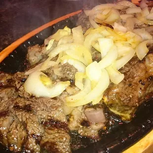 steak and onions on a platter