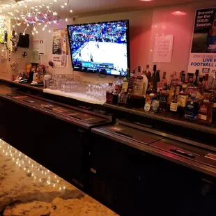 a bar with a large screen tv